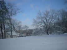 House and field in a blanket of snow
