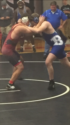 Searcy Wrestler tied up with his opponent