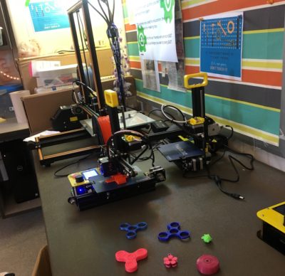 EAST Program's newly received 3D printer with example fidgets.