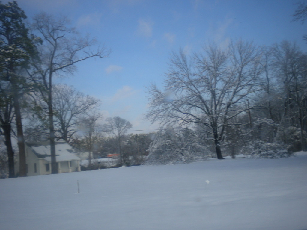 House and field in a blanket of snow